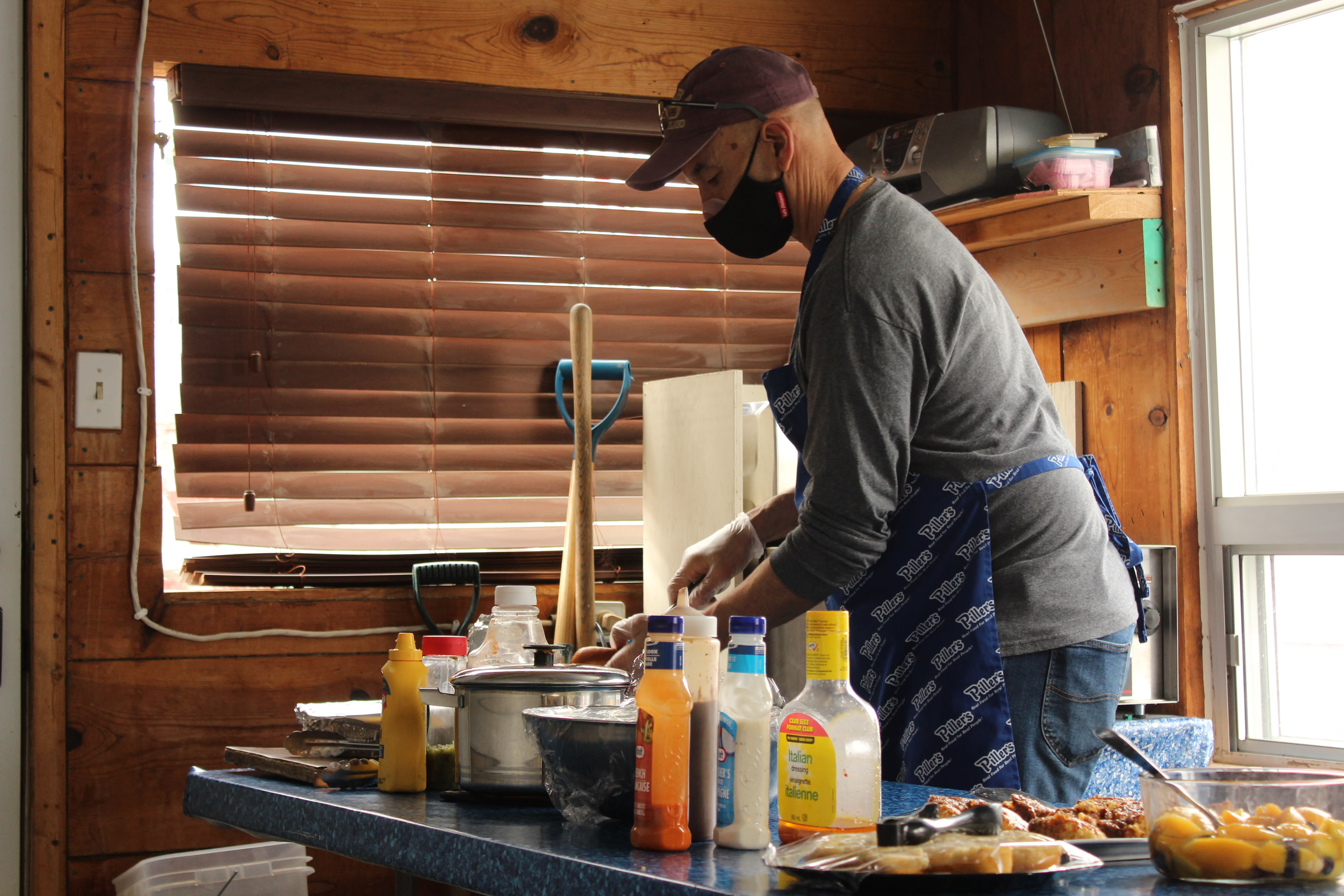 Habitat Waterloo Region volunteer making food